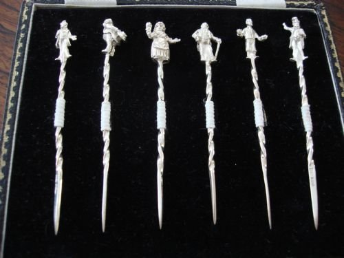 cast solid silver cased fruit or cocktail sticks in original fitted case
